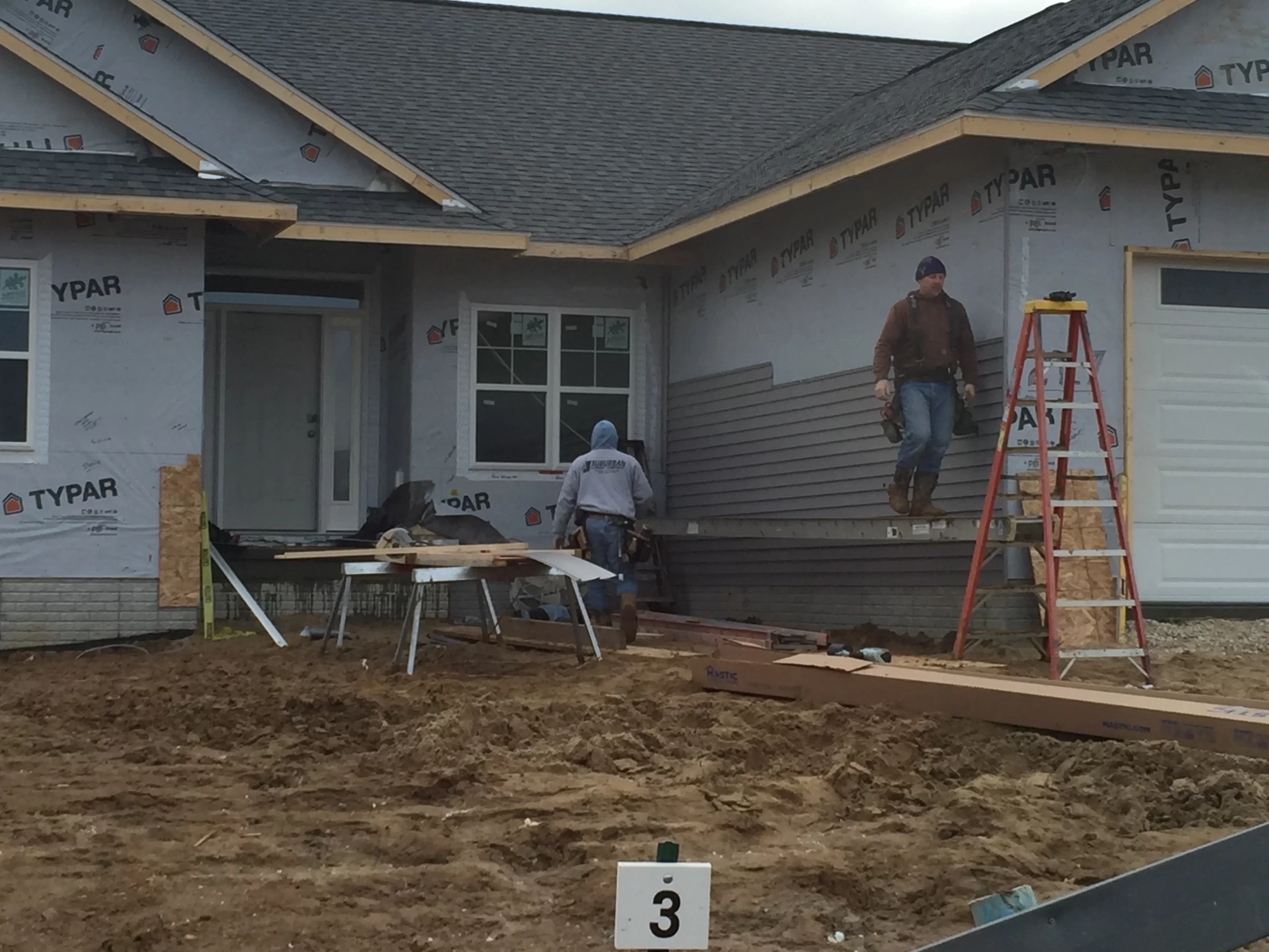 Professional Siding Installation by Trego Custom Homes Trego Custom Homes crew installing fresh siding on a custom hom